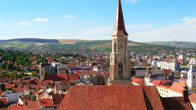 Aerial drone view of Saint Michael Church in Cluj, Romania. Cityscape, central square, old buildings