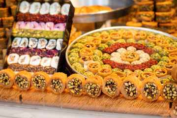 Kadayif traditional ottoman and arabic dessert with sugar noodles and nuts filling. Pastry and turkish baklava for sale