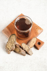 Obraz na płótnie Canvas A glass of herbal drink with spices