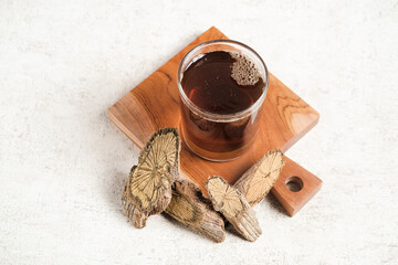 Obraz na płótnie Canvas A glass of herbal drink with spices