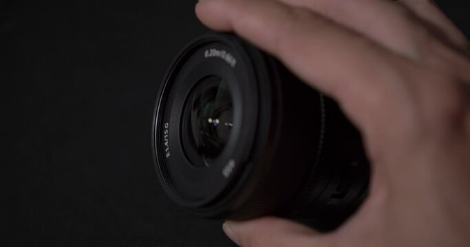 Front and back view of Sony Apsc lenses E 15mm f1.4 GM black background and light reflection photography apsc sony camera