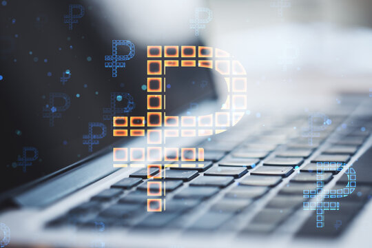 Close up of laptop computer on desktop with creative glowing Russian ruble hologram on blurry background. Digital money and online banking concept. Double exposure.