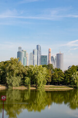 Fototapeta premium Moscow, Russia - August 3, 2022 : High-rise buildings in the capital of the Russia. Complex Moscow-city against the blue sky.