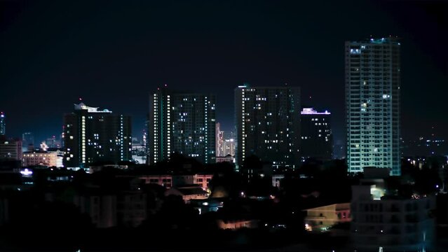 city skyline at night in thailand.