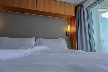 Comfortable double bed with duvet in luxurious oceanview or ocean view or outside or exterior...