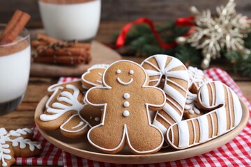 Delicious gingerbread Christmas cookies on table, closeup
