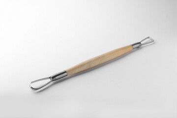 Ribbon tool for clay modeling on white background