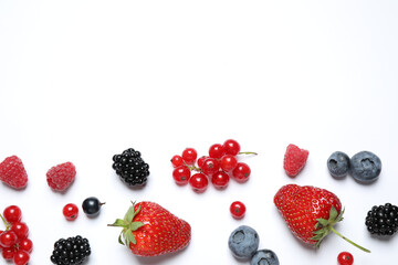 Mix of fresh berries on white background, flat lay
