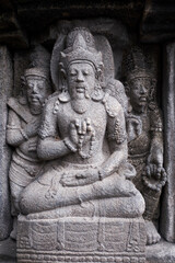 Carving Relief In Prambanan Temple. The temple is adorned with panels of narrative bas-reliefs telling the story of the Hindu epic Ramayana and Bhagavata Purana.