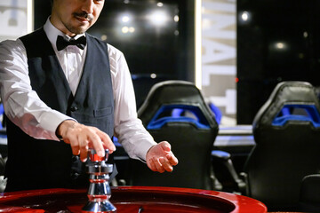 Image of casino dealers and black suits Faceless