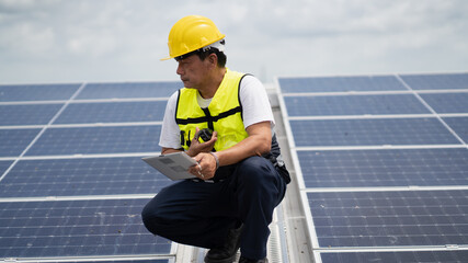 Construction workers clean solar panels for energy.Renewable Energy Battery Clean Mountain Climber...