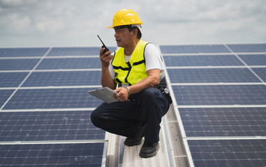 Construction workers clean solar panels for energy.Renewable Energy Battery Clean Mountain Climber Activities Work Uniforms.Managers discuss electric power ecology, human, renewable energy.
