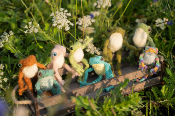 knitted frogs on the grass