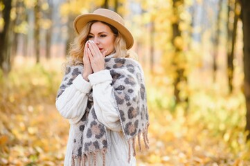 cold sick beautiful beautiful woman in autumn, toning