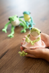knitted frogs on the table