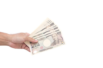 Man hand holding 10000 Japanese Yen banknote