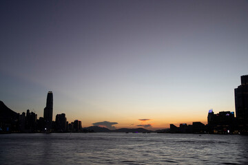 2022 July 18,Hong Kong .Sunset on the Victoria Harbour in East Coast Park Precinct,Hong Kong
