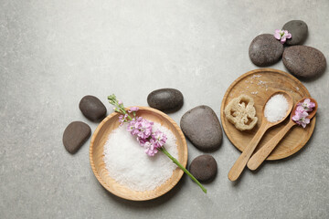 Plakat Flat lay composition with sea salt and spa stones on grey marble table