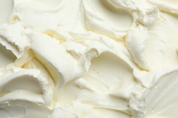 Closeup of tasty cream cheese as background, top view