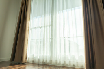 Naklejka na ściany i meble Curtain window interior decoration in living room on sunny day with sunlight