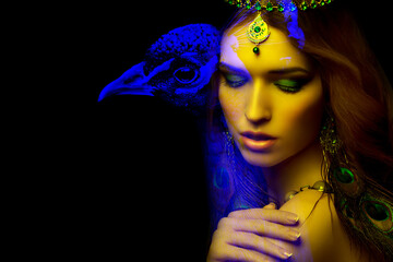 Beautiful young woman and a peacock, the concept of a werewolf or shapeshifter, double exposure,...