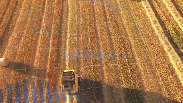 Animation of statistical data processing over aerial view of tractor operating in farm fields