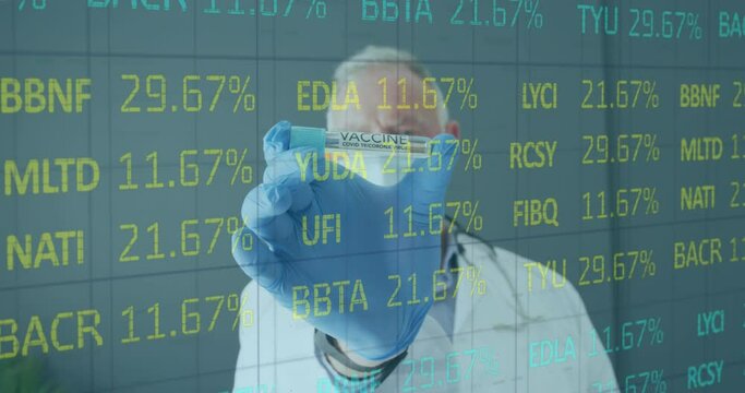 Animation of stock market data processing over caucasian male doctor holding covid-19 vaccine
