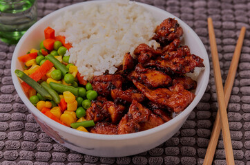 Teriyaki chicken with rice and mixed vegetables.