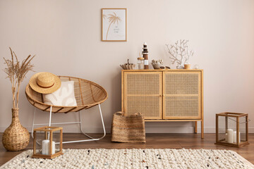 Interior design of cozy and summer living room with rattan armchair, commode, pillows, mock u...