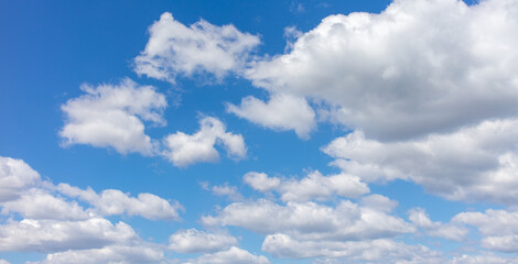 White clouds against the blue sky.