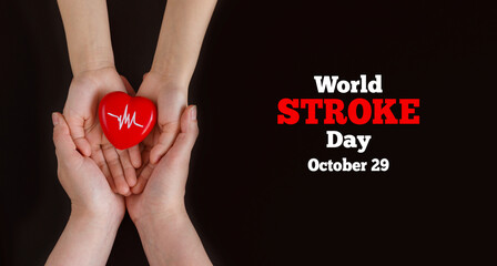 World Stroke day. October 29. The hands of the mother and child hold a heart with a heartbeat...