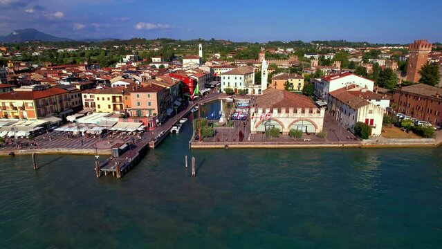  Scenic lake Lago di Garda. aerial video of Lazise- medieval village and castle. Italy, Verona province