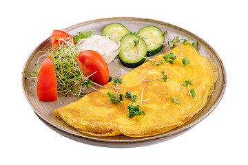 Omelet with cheese and parsley, sliced tomatoes and cucumbers on the plate