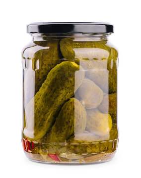 A glass jar of tasties canned cucumbers on white background