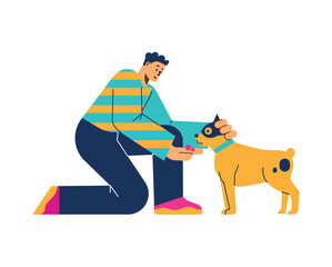 Young boy petting dog and giving it delicacy for following command flat style