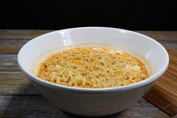 Boiled instant noodle serving in the bowl. Low cost and cheap menu. Comfortable food concept. 