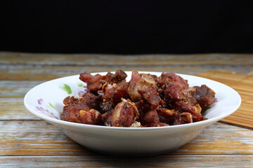 Traditional deep fried sour pork serving on the plate. Famous appetizer menu in Asia restaurant.