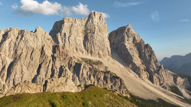 View from above, stunning aerial view of a person enjoying the view of Monte Pelmo from the summit of Col de la Puina. Monte Pelmo, Dolomites, Italy.