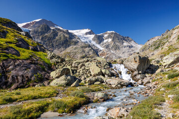 Fototapeta na wymiar mountain creek in front of Steingletscher on Sustenpass in the Bernese Alps