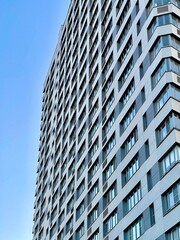 Modern office building on blue sky background