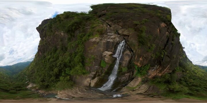 Tall tropical waterfall in the mountains of Sri Lanka. Rawana Falls. 360 panorama VR.