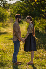 young couple hugging on nature background