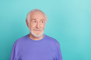 Portrait of minded creative person look interested empty space contemplate isolated on teal color...