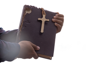 Human holding Old Holy Bible and Cross isolated on white background. Religion and Hope Concept.