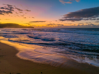 Obraz premium Aerial sunrise at the beach with clouds