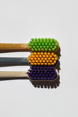 three different toothbrushes made from recycled plastic. eco product