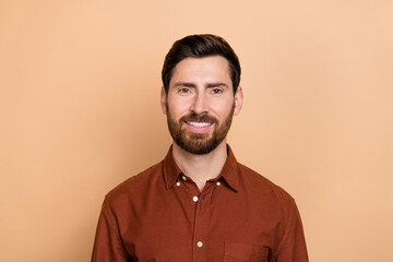Photo of satisfied candid person toothy beaming smile look camera isolated on beige color background