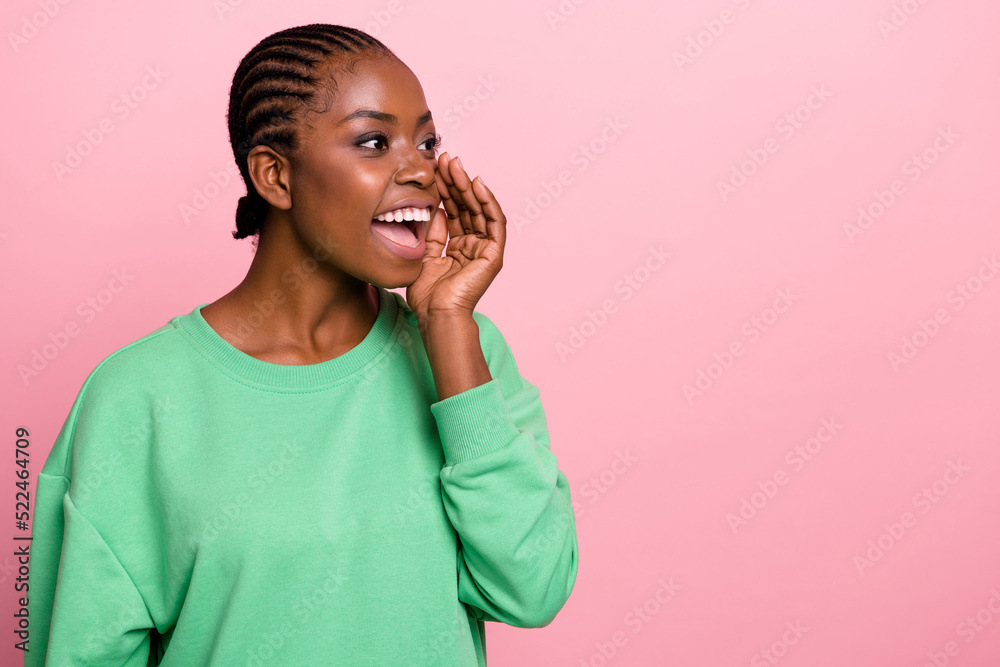 Wall mural Photo of positive charming person hand near open mouth look tell empty space isolated on pink color background