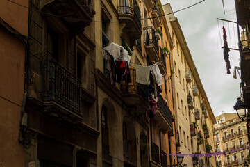 Fototapeta na wymiar Barcelona street with washing hanging from balcony