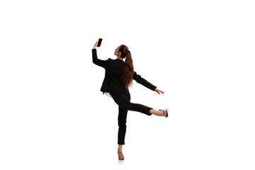 Happy business woman dancing and smiling isolated over white background. Emotions, finance, aspiration, business, job concept.